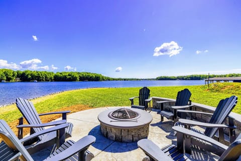 Relax by the fire pit with panoramic lake views in a serene and picturesque setting