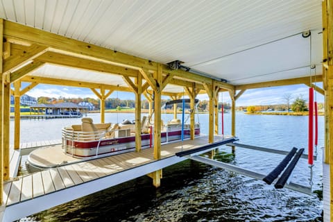 A covered boat slip wiith beautiful lake access