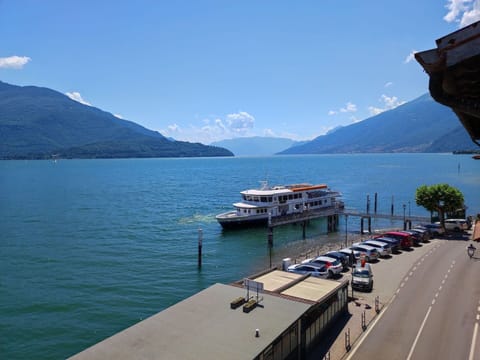 Water, Sky, Cloud, Boat, Mountain, Vehicle, Watercraft, Car, Lake, Body Of Water