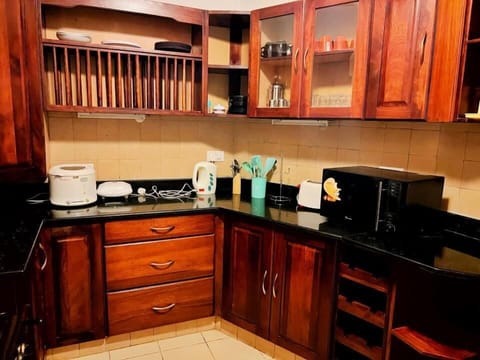 Design Penthouse | Private kitchen | Fridge, microwave, cookware/dishes/utensils, dining tables