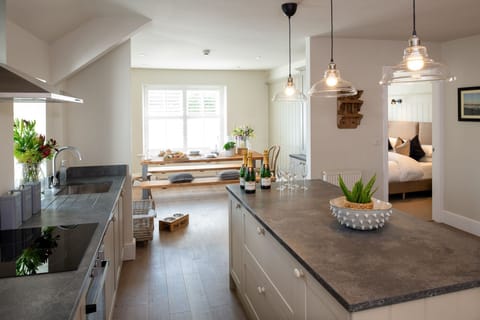 The Roost - The Nest at The White Eagle - kitchen island, dining area