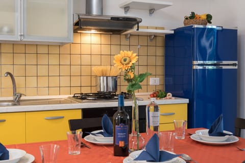 Family Apartment | Private kitchen | Full-size fridge, stovetop, coffee grinder, cookware/dishes/utensils