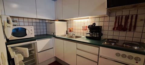 Vollausgestattete Küche, wo Sie sich kulinarisch entfalten können. 