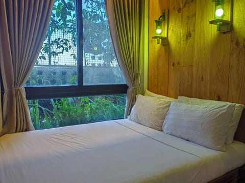 Garden View Room | Blackout drapes, rollaway beds, bed sheets