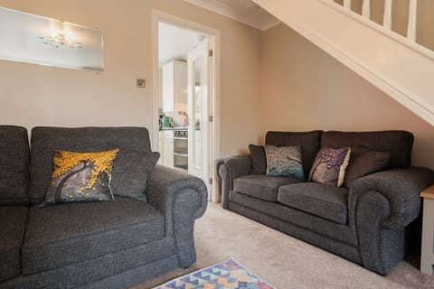 The Living Room: Cosy up on the comfortable sofas in the light & airy living room space.