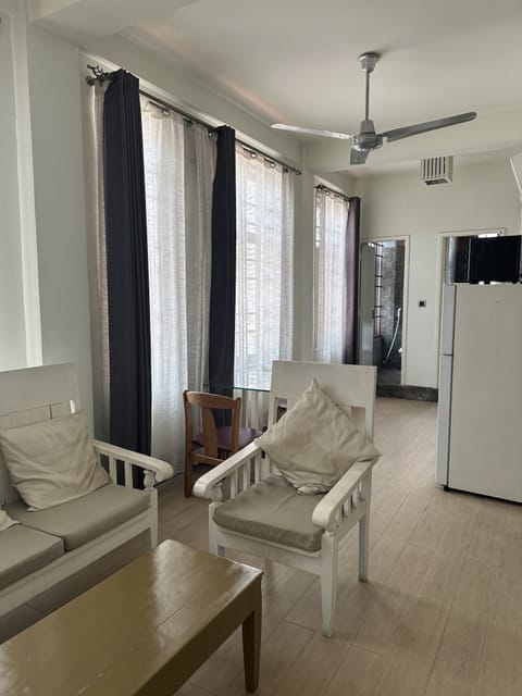 Elite Apartment | Living area | 40-inch LCD TV with cable channels, fireplace