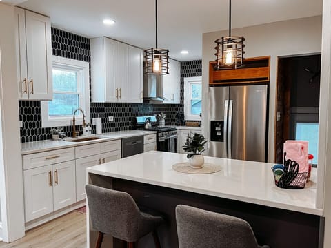 `Indulge your inner chef in our beautifully designed kitchen area.`