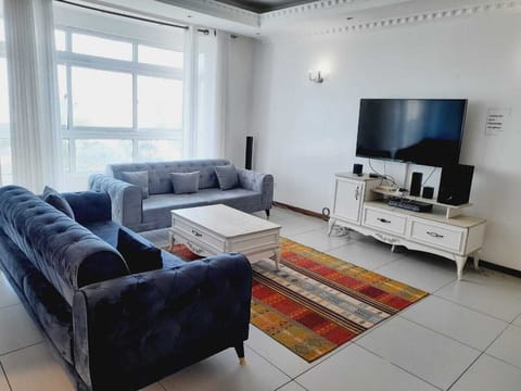 Family Apartment | Living area | 24-inch Smart TV with digital channels