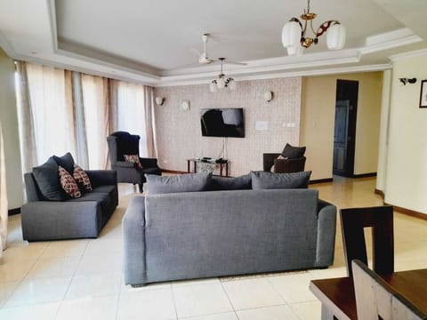 Exclusive Apartment | Living area | 24-inch Smart TV with digital channels