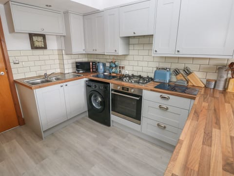 Fridge, electric kettle, toaster, cookware/dishes/utensils