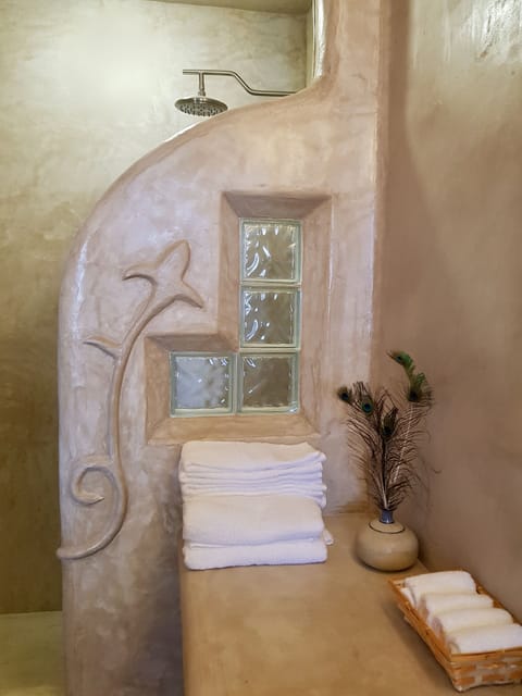 Signature Suite | Bathroom | Shower, rainfall showerhead, hair dryer, towels