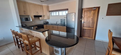 Standard Apartment | Private kitchen | Full-size fridge, microwave, oven, stovetop