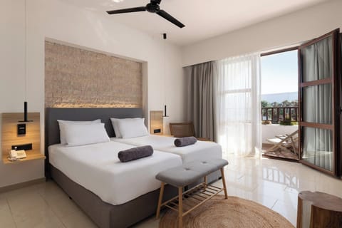 Family Suite, Partial Sea View | Premium bedding, free minibar items, soundproofing, iron/ironing board