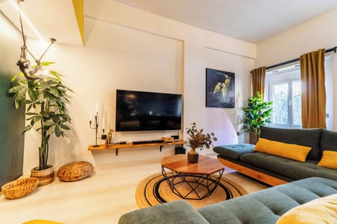 Elegant and sunny living room with TV, warm lighting