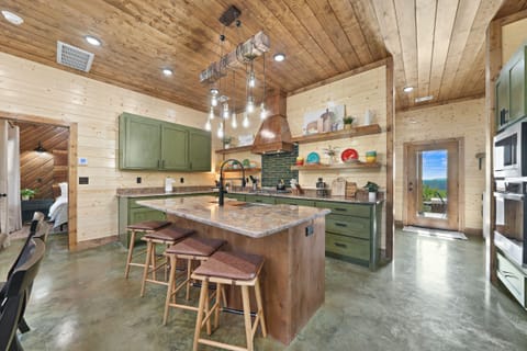 The barstool seating at the kitchen island is a sweet spot for sipping beverages and enjoying breakfast, lunch, or a snack.