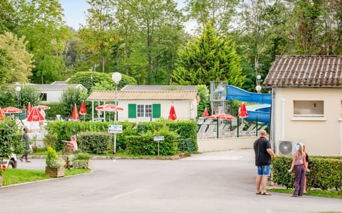 A charming campground scene, with paths and greenery creating a welcoming environment for leisurely strolls and community connections.