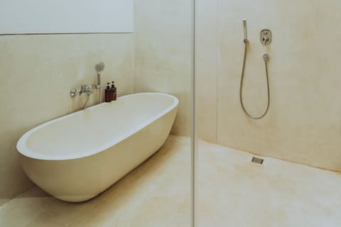 Villa | Bathroom | Separate tub and shower, hair dryer, towels, soap
