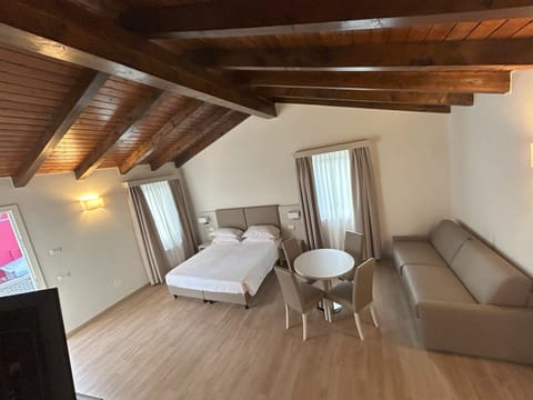 Family Studio, 1 Bedroom, Kitchenette, Tower | Living area | Flat-screen TV