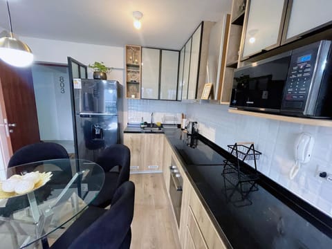 Panoramic Apartment | Private kitchen | Full-size fridge, microwave, oven, dishwasher