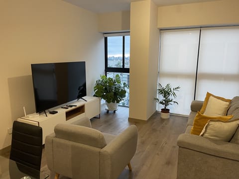 Business Apartment | Living area | Flat-screen TV