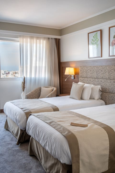 Premium bedding, pillowtop beds, free minibar items, in-room safe