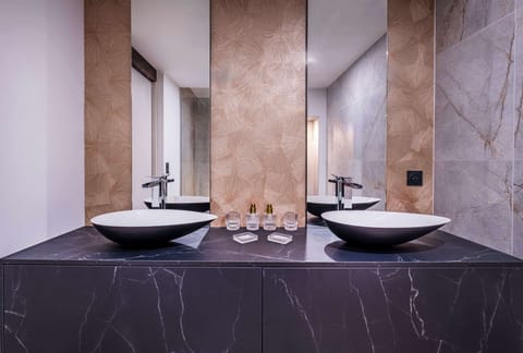 Suite, 1 King Bed | Bathroom | Shower, hair dryer, towels