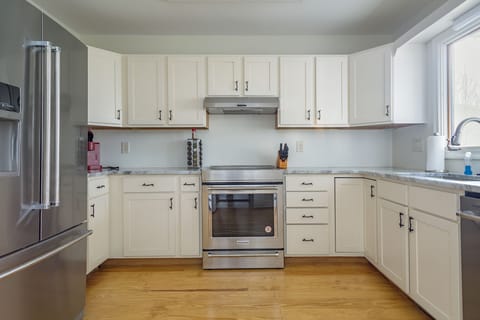 Kitchen with stainless appliances, dishwasher & Keurig coffeemaker.