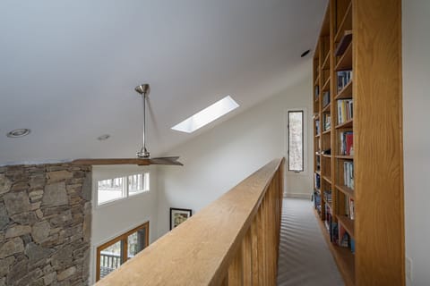 Bookshelves in the upper-level landing area.