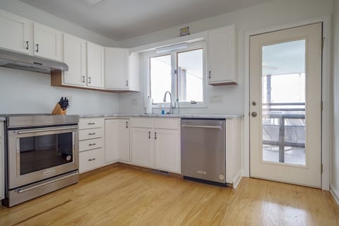 Kitchen with stainless appliances, dishwasher & Keurig coffeemaker.
