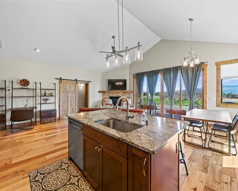 Open-concept living room with cozy seating and panoramic views.