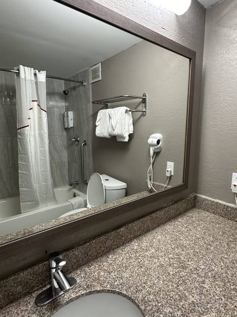 Combined shower/tub, hair dryer, towels, soap