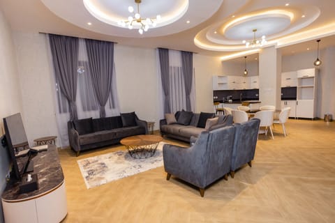 Presidential Penthouse, City View | Living area | 55-inch flat-screen TV with cable channels, TV