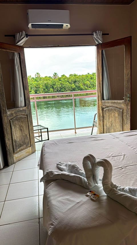 Standard Double Room, River View | Minibar, bed sheets