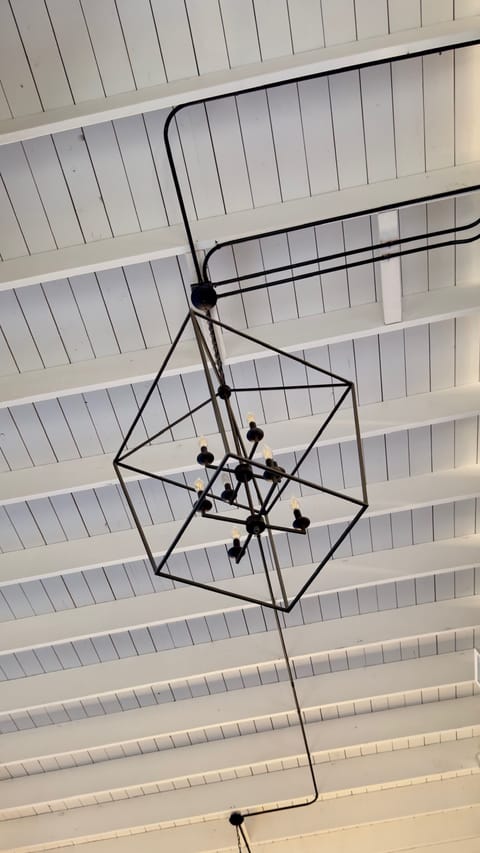 Exposed beam ceiling with unique lighting