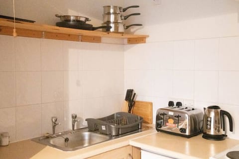 Comfort Apartment | Private kitchen | Full-size fridge, microwave, oven, stovetop