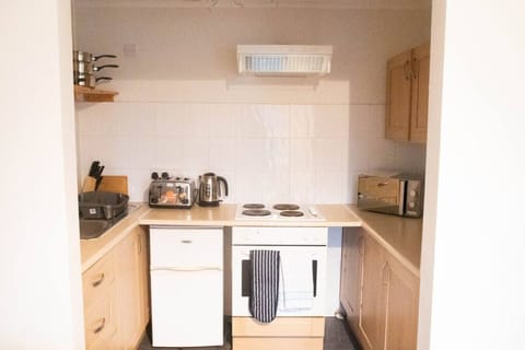 Comfort Apartment | Private kitchen | Full-size fridge, microwave, oven, stovetop