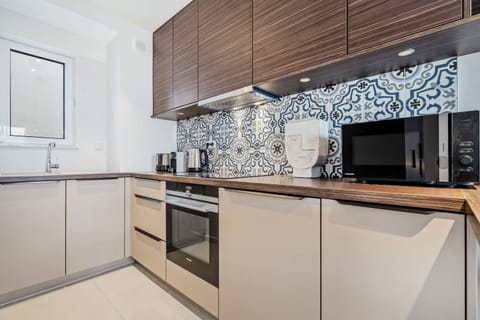 Chic tiles and dark wood: the perfect recipe for stylish eats.