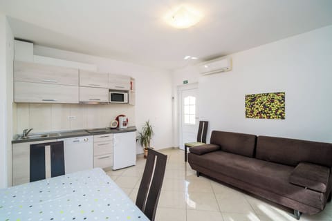 Apartment (Superior One-Bedroom Apartment) | Living room | 25-inch flat-screen TV with satellite channels, TV