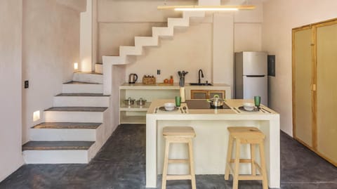 Cook, create, and connect in your full kitchen, where sleek design meets open space — perfect for whipping up local flavors or late-night snacks.