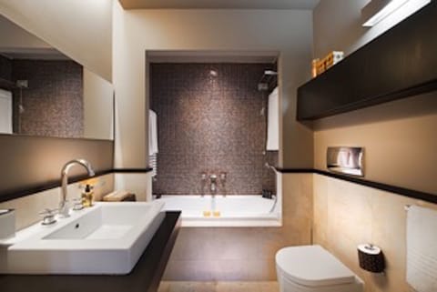 Suite, 1 Queen Bed | Bathroom | Rainfall showerhead, designer toiletries, hair dryer, bathrobes