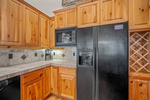 Drip coffee pot and coffee await you.