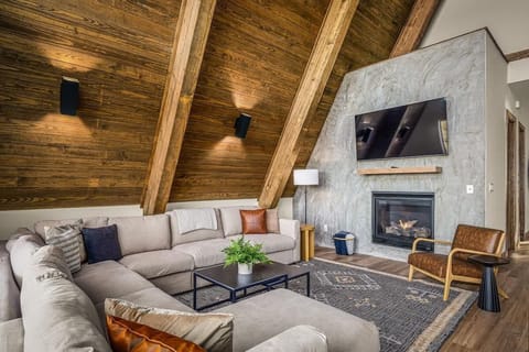 [Living area] Smart TV & indoor fireplace under 30’ ceilings