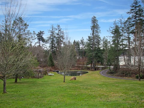 Enjoy views of the swimming pond and filtered views of Sportsmans Lake across the road.