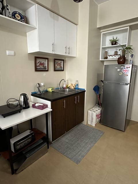 Luxury Apartment | Private kitchen | Full-size fridge, microwave, stovetop, rice cooker