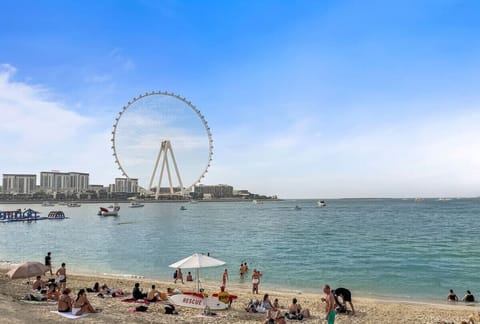 Beachfront Bliss: Experience stunning views and vibrant beach life just steps from your door!