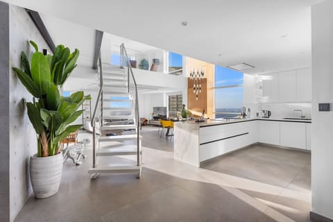 Open-Concept Living Space: Experience airy elegance with stunning views and chic decor!