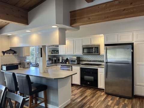 Kitchen, microwave, stove, oven and coffee. 