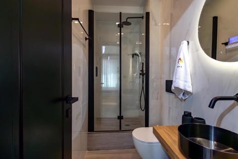 Family Studio | Bathroom | Shower, hair dryer, towels