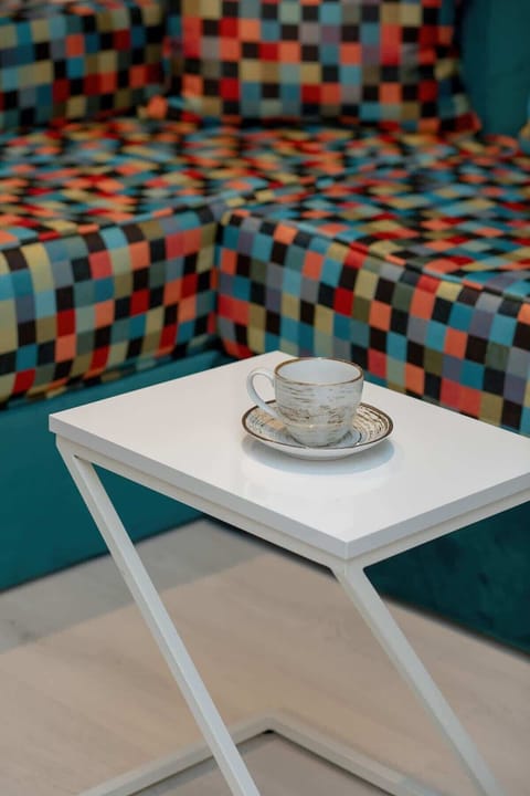 A coffee table with a neatly arranged coffee set, adding a touch of luxury and comfort.

