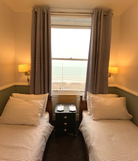 Twin Room, Private Bathroom, Sea View | Individually decorated, individually furnished, free WiFi, bed sheets